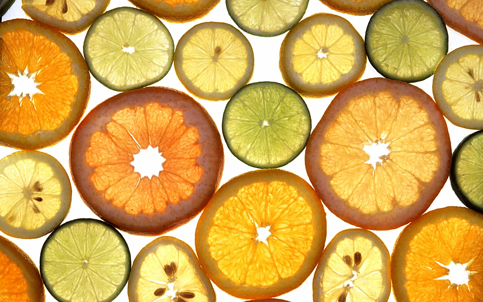 Fresh citrus fruits including lemons and oranges, arranged together